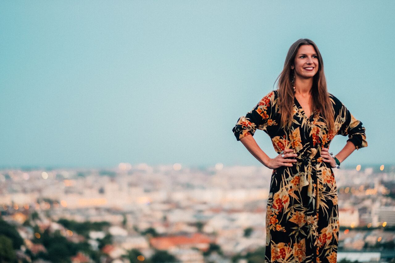 Emilia Gacsalyi standing above the Budapest skyline